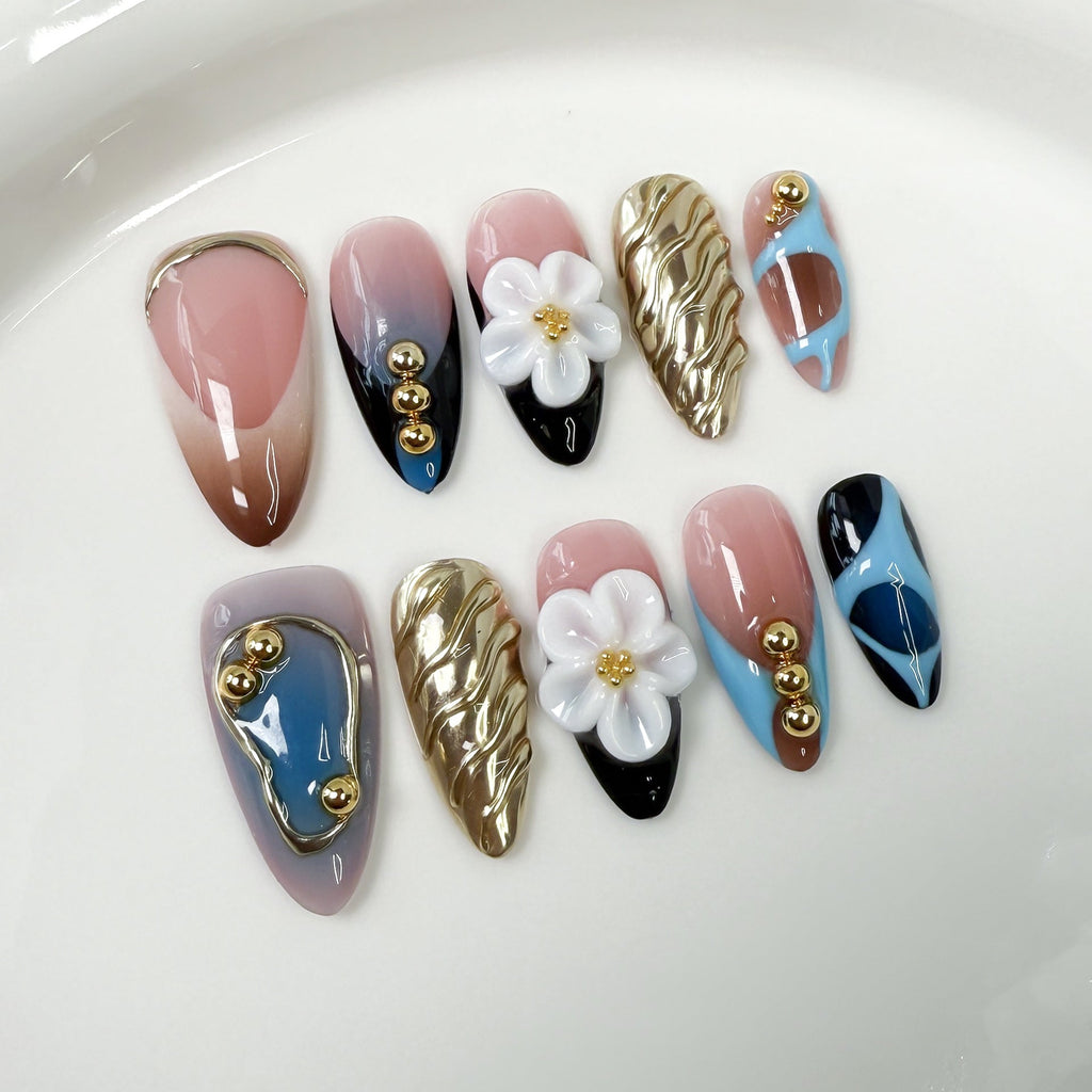 Trendy Press-On Nails with Gold Accents and Floral 3D Details