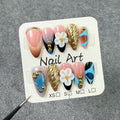 Trendy Press-On Nails with Gold Accents and Floral 3D Details